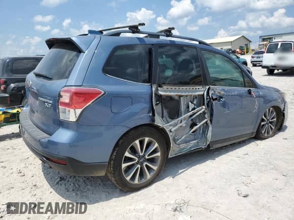 2018 Subaru Forester Touring with VIN JF2SJGWC4JH535224, listed as a Copart auction lot 61912065 with 100,930 mi miles and Salvage title. Bid and sale history available at DreamBid. Image 3.