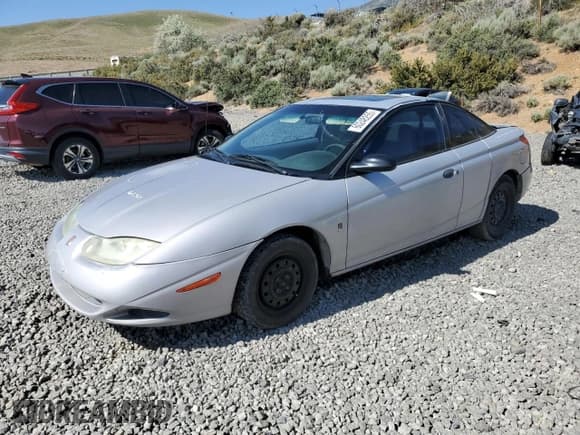 ✅ 2001 Saturn SC • VIN: 1G8ZP12891Z219977 • Лот: 60248255. Опубликован ранее на Copart с пробегом 230 514 миль. Бесплатный доступ к архиву аукционных продаж из США и подробный отчёт об истории автомобиля на DreamBid. Изображение 1.