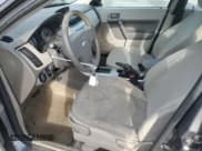 ✅ 2010 Ford Focus S • VIN: 1FAHP3EN2AW143220 • Lot: 90918375. Wystawiony na Copart z przebiegiem 166 935 mil. Bezpłatny archiwum sprzedaży aukcyjnych z USA i szczegółowy raport historii pojazdu na DreamBid. Zdjęcie 7.