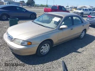 ✅ 1999 Mazda 626 ES • VIN: 1YVGF22C5X5811946 • Лот: 41970165. Опубликован ранее на IAAI с пробегом 126 709 миль. Бесплатный доступ к архиву аукционных продаж из США и подробный отчёт об истории автомобиля на DreamBid. Изображение 2.