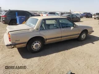 ✅ 1987 Oldsmobile 88 • VIN: 1G3HY5137HW311807 • Lot: 74605344. Wystawiony na Copart z przebiegiem 124 614 mil. Bezpłatny archiwum sprzedaży aukcyjnych z USA i szczegółowy raport historii pojazdu na DreamBid. Zdjęcie 3.
