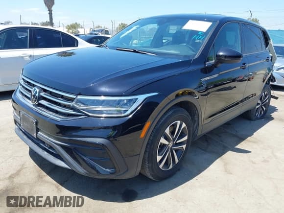 ✅ 2023 Volkswagen Tiguan S • VIN: 3VVRB7AX3PM064709 • Lot: 42103656. Listed on IAAI with 17,157 mi. Free auction sales archive from the USA and detailed vehicle history report at DreamBid. Image 2.