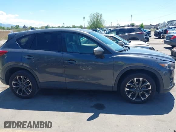 ✅ 2016 Mazda CX-5 Grand Touring • VIN: JM3KE4DY3G0912088 • Lot: 42203530. Wystawiony na IAAI z przebiegiem 86 914 mil. Bezpłatny archiwum sprzedaży aukcyjnych z USA i szczegółowy raport historii pojazdu na DreamBid. Zdjęcie 13.