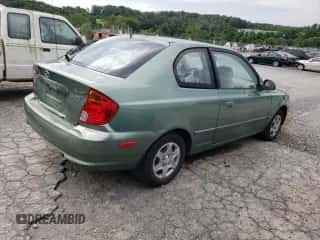 2005 Hyundai Accent GLS z VIN KMHCG35C05U325871, wystawiony jako Copart lot #64258985 z przebiegiem 166 574 mil mil oraz Szkoda całkowita • Salvage title. Historia ofert i sprzedaży dostępna na DreamBid. Obrazek 3.