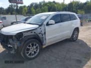 ✅ 2015 Jeep Grand Cherokee Summit • VIN: 1C4RJEJG5FC105296 • Lot: 43231201. Listed on IAAI with 124,311 mi. Free auction sales archive from the USA and detailed vehicle history report at DreamBid. Image 2.