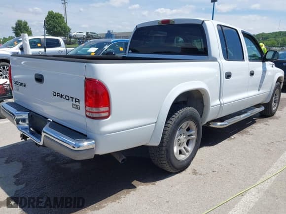 ✅ 2003 Dodge Dakota SLT • VIN: 1D7HL48X73S126440 • Lot: 42330513. Wystawiony na IAAI z przebiegiem 223 959 mil. Bezpłatny archiwum sprzedaży aukcyjnych z USA i szczegółowy raport historii pojazdu na DreamBid. Zdjęcie 4.