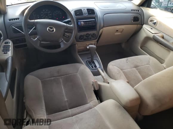 ✅ 2001 Mazda Protege DX • VIN: JM1BJ222410441812 • Лот: 88330565. Опубликован ранее на Copart с пробегом 169 447 миль. Бесплатный доступ к архиву аукционных продаж из США и подробный отчёт об истории автомобиля на DreamBid. Изображение 8.