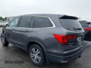 ✅ 2017 Honda Pilot EX-L • VIN: 5FNYF5H77HB033090 • Lot: 42359412. Listed on IAAI with 131,032 mi. Free auction sales archive from the USA and detailed vehicle history report at DreamBid. Image 3.