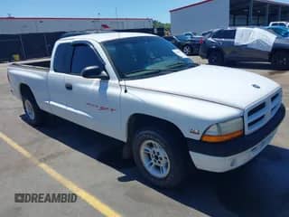 1999 Dodge Dakota SLT with VIN 1B7GL22X0XS193423, listed as a IAAI auction lot 42053562 with 209,802 mi miles and . Bid and sale history available at DreamBid. Image 1.