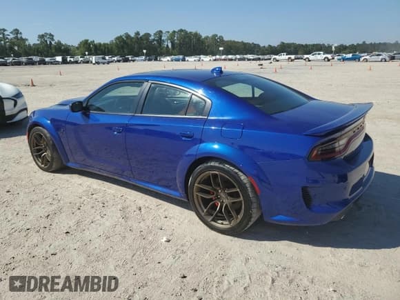 ✅ 2022 Dodge Charger SRT Hellcat Widebody • VIN: 2C3CDXL97NH159335 • Lot: 74745504. Listed on Copart with 13,630 mi. Free auction sales archive from the USA and detailed vehicle history report at DreamBid. Image 2.