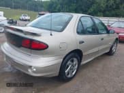✅ 2002 Pontiac Sunfire SE • VIN: 1G2JB52F527374700 • Lot: 42844988. Listed on IAAI with 144,043 mi. Free auction sales archive from the USA and detailed vehicle history report at DreamBid. Image 4.