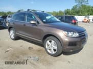 ✅ 2013 Volkswagen Touareg Lux • VIN: WVGEF9BP6DD013932 • Lot: 62047945. Listed on Copart with 127,821 mi. Free auction sales archive from the USA and detailed vehicle history report at DreamBid. Image 4.