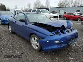 2001 Hyundai Tiburon z VIN KMHJG25F91U250108, wystawiony jako Copart lot #50905795 z przebiegiem 61 803 mil mil oraz Szkoda całkowita • Salvage title. Historia ofert i sprzedaży dostępna na DreamBid. Obrazek 4.