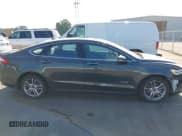 ✅ 2015 Ford Fusion Titanium • VIN: 3FA6P0SU8FR243611 • Lot: 43169838. Wystawiony na IAAI z przebiegiem 131 248 mil. Bezpłatny archiwum sprzedaży aukcyjnych z USA i szczegółowy raport historii pojazdu na DreamBid. Zdjęcie 13.