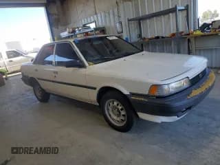 ✅ 1991 Toyota Camry • VIN: 4T1SV24E0MU402588 • Lot: 82920114. Listed on Copart with 124,644 mi. Free auction sales archive from the USA and detailed vehicle history report at DreamBid. Image 4.