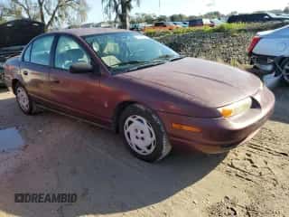 2001 Saturn SL z VIN 1G8ZK52711Z324512, wystawiony jako Copart lot #73812924 z przebiegiem 121 284 mil mil oraz Szkoda całkowita • Salvage title. Historia ofert i sprzedaży dostępna na DreamBid. Obrazek 4.