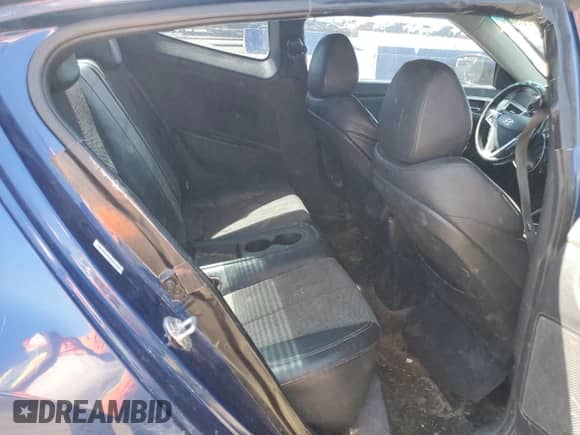 2015 Hyundai Veloster z VIN KMHTC6AD0FU241885, wystawiony jako Copart lot #70447094 z przebiegiem 175 075 mil mil oraz Szkoda całkowita • Salvage title. Historia ofert i sprzedaży dostępna na DreamBid. Obrazek 10.