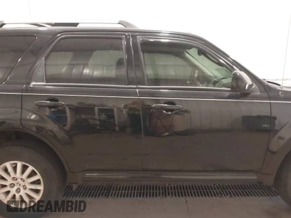 2010 Mercury Mariner Premier with VIN 4M2CN9HG2AKJ19690, listed as a IAAI auction lot 43221081 with 136,828 mi miles and . Bid and sale history available at DreamBid. Image 13.