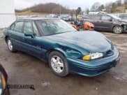 ✅ 1996 Pontiac Bonneville • VIN: 1G2HZ5210TH210829 • Lot: 41203888. Listed on IAAI with 154,990 mi. Free auction sales archive from the USA and detailed vehicle history report at DreamBid. Image 1.