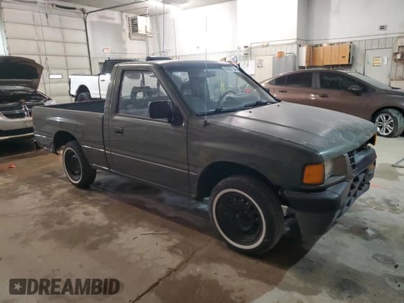 ✅ 1995 Isuzu Pickup S • VIN: JAACL11L0S7211543 • Лот: 81881194. Опубликован ранее на Copart с пробегом 215 222 миль. Бесплатный доступ к архиву аукционных продаж из США и подробный отчёт об истории автомобиля на DreamBid. Изображение 4.