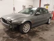 ✅ 2003 Jaguar X-Type 2.5L Manual • VIN: SAJEA51D33XD13416 • Lot: 43210908. Listed on IAAI with 195,057 mi. Free auction sales archive from the USA and detailed vehicle history report at DreamBid. Image 17.