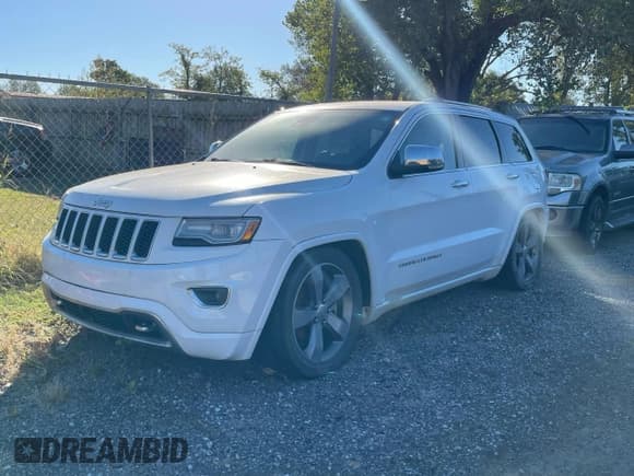 ✅ 2014 Jeep Grand Cherokee Overland • VIN: 1C4RJFCM6EC487877 • Lot: 89649015. Listed on Copart with 124,903 mi. Free auction sales archive from the USA and detailed vehicle history report at DreamBid. Image 2.