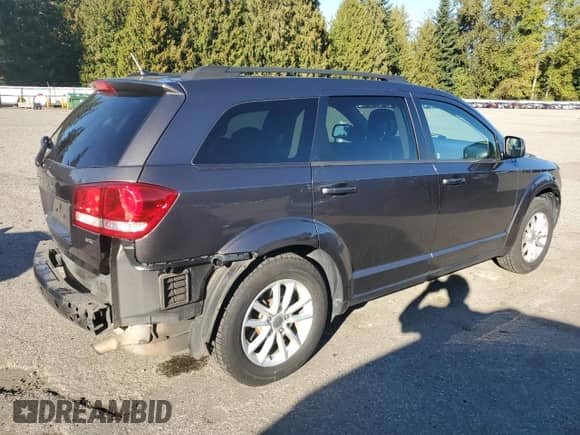 2015 Dodge Journey SXT with VIN 3C4PDCBB1FT698097, listed as a Copart auction lot 85335395 with 103,167 mi miles and Salvage title. Bid and sale history available at DreamBid. Image 3.