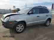 2009 Hyundai Tucson GLS with VIN KM8JM12B79U012399, listed as a Copart auction lot 77663414 with 164,615 mi miles and Salvage title. Bid and sale history available at DreamBid. Image 1.