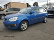 ✅ 2007 Kia Rio SX • VIN: KNADE163176196559 • Лот: 92210485. Опубликован ранее на Copart с пробегом 67 647 миль. Бесплатный доступ к архиву аукционных продаж из США и подробный отчёт об истории автомобиля на DreamBid. Изображение 1.