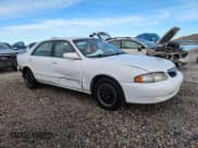 ✅ 1999 Mazda 626 ES • VIN: 1YVGF22C9X5887587 • Лот: 46346305. Опубликован ранее на Copart с пробегом 92 715 миль. Бесплатный доступ к архиву аукционных продаж из США и подробный отчёт об истории автомобиля на DreamBid. Изображение 4.