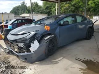 ✅ 2023 Toyota Prius LE • VIN: JTDACAAU4P3008727 • Lot: 69977245. Wystawiony na Copart z przebiegiem 333 333 mil. Bezpłatny archiwum sprzedaży aukcyjnych z USA i szczegółowy raport historii pojazdu na DreamBid. Zdjęcie 1.