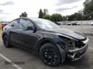 ✅ 2023 Tesla Model Y • VIN: 7SAYGDED1PF941165 • Lot: 71301845. Listed on Copart with 18,142 mi. Free auction sales archive from the USA and detailed vehicle history report at DreamBid. Image 4.