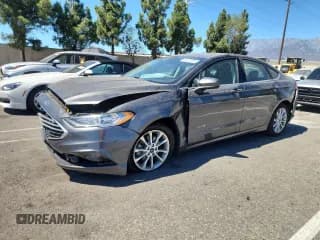 ✅ 2017 Ford Fusion Hybrid S • VIN: 3FA6P0UU5HR256414 • Lot: 72017725. Wystawiony na Copart z przebiegiem 89 460 mil. Bezpłatny archiwum sprzedaży aukcyjnych z USA i szczegółowy raport historii pojazdu na DreamBid. Zdjęcie 1.