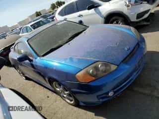 2004 Hyundai Tiburon GT z VIN KMHHN65F94U133810, wystawiony jako Copart lot #63740764 z przebiegiem 131 180 mil mil oraz Szkoda całkowita • Salvage title. Historia ofert i sprzedaży dostępna na DreamBid. Obrazek 4.