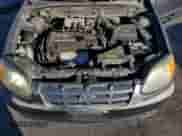 2005 Hyundai Accent GLS with VIN KMHCG45C95U665574, listed as a Copart auction lot 82603804 with 154,187 mi miles and Salvage title. Bid and sale history available at DreamBid. Image 12.