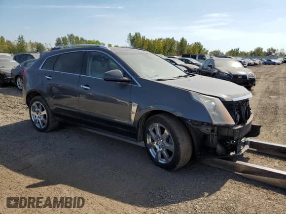 ✅ 2012 Cadillac SRX Performance Collection • VIN: 3GYFNBE39CS617477 • Lot: 72263264. Listed on Copart with 97,675 mi. Free auction sales archive from the USA and detailed vehicle history report at DreamBid. Image 4.