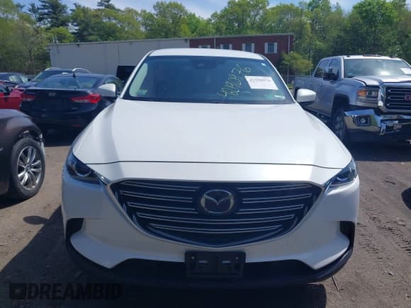 ✅ 2021 Mazda CX-9 Touring • VIN: JM3TCBCYXM0521323 • Lot: 42190976. Listed on IAAI with 56,652 mi. Free auction sales archive from the USA and detailed vehicle history report at DreamBid. Image 12.