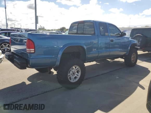 2003 Dodge Dakota с VIN 1D7HG12X93S267179, выставлен на аукционе Copart как лот 74291174 с пробегом Не указан миль и На запчасти • Non repairable. История ставок и продаж доступна на DreamBid. Изображение 3.