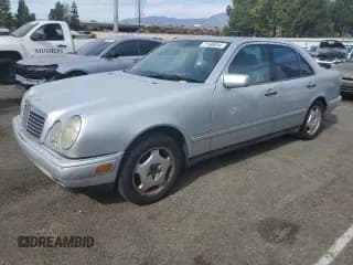 ✅ 1998 Mercedes-Benz E • VIN: WDBJF70F6WA643471 • Lot: 77189934. Listed on Copart with 251,579 mi. Free auction sales archive from the USA and detailed vehicle history report at DreamBid. Image 1.