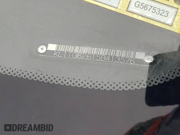 2005 Chevrolet Aveo LT z VIN KL1TG62615B413576, wystawiony jako Copart lot #67797175 z przebiegiem 90 290 mil mil oraz Szkoda całkowita • Salvage title. Historia ofert i sprzedaży dostępna na DreamBid. Obrazek 13.