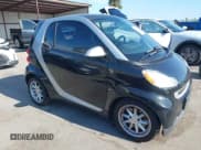 ✅ 2009 Smart fortwo Pure • VIN: WMEEJ31X19K220847 • Lot: 42817145. Listed on IAAI with 130,888 mi. Free auction sales archive from the USA and detailed vehicle history report at DreamBid. Image 1.
