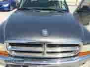 2001 Dodge Dakota Sport z VIN 1B7HL2AN61S301927, wystawiony jako Copart lot #74676094 z przebiegiem 228 616 mil mil oraz Szkoda całkowita • Salvage title. Historia ofert i sprzedaży dostępna na DreamBid. Obrazek 11.
