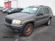 ✅ 1999 Jeep Grand Cherokee Limited • VIN: 1J4GW68N2XC597168 • Лот: 43682218. Опубликован ранее на IAAI с пробегом 145 584 миль. Бесплатный доступ к архиву аукционных продаж из США и подробный отчёт об истории автомобиля на DreamBid. Изображение 2.