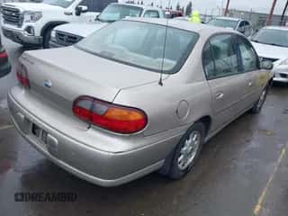 1998 Chevrolet Malibu LS z VIN 1G1NE52M1W6249023, wystawiony jako IAAI lot #41779319 z przebiegiem 71 307 mil mil oraz . Historia ofert i sprzedaży dostępna na DreamBid. Obrazek 4.