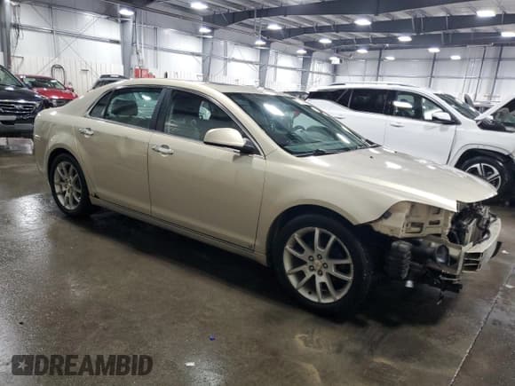 ✅ 2010 Chevrolet Malibu LTZ • VIN: 1G1ZE5E00AF131614 • Lot: 79124684. Listed on Copart with 252,614 mi. Free auction sales archive from the USA and detailed vehicle history report at DreamBid. Image 4.
