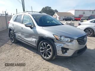 ✅ 2016 Mazda CX-5 Grand Touring • VIN: JM3KE4DY0G0856658 • Lot: 43778076. Wystawiony na IAAI z przebiegiem 103 388 mil. Bezpłatny archiwum sprzedaży aukcyjnych z USA i szczegółowy raport historii pojazdu na DreamBid. Zdjęcie 1.