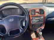 2004 Hyundai Sonata GLS with VIN KMHWF35H74A973171, listed as a Copart auction lot 77613394 with 151,973 mi miles and Clean title. Bid and sale history available at DreamBid. Image 9.