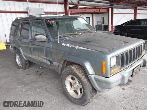 ✅ 1999 Jeep Cherokee Sport • VIN: 1J4FF68S4XL605305 • Lot: 43863356. Listed on IAAI with 232,672 mi. Free auction sales archive from the USA and detailed vehicle history report at DreamBid. Image 1.