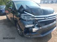 ✅ 2017 Honda Pilot EX-L • VIN: 5FNYF6H57HB032784 • Lot: 42893011. Listed on IAAI with 125,407 mi. Free auction sales archive from the USA and detailed vehicle history report at DreamBid. Image 6.