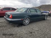 ✅ 2005 Jaguar XJ 8 LWB • VIN: SAJWA79C65SG34572 • Лот: 93790045. Опубликован ранее на Copart с пробегом 148 958 миль. Бесплатный доступ к архиву аукционных продаж из США и подробный отчёт об истории автомобиля на DreamBid. Изображение 3.